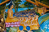 Luang Prabang, Laos - Wat Xieng Mouan with the faade decorated with brightly painted Jataka tales. 